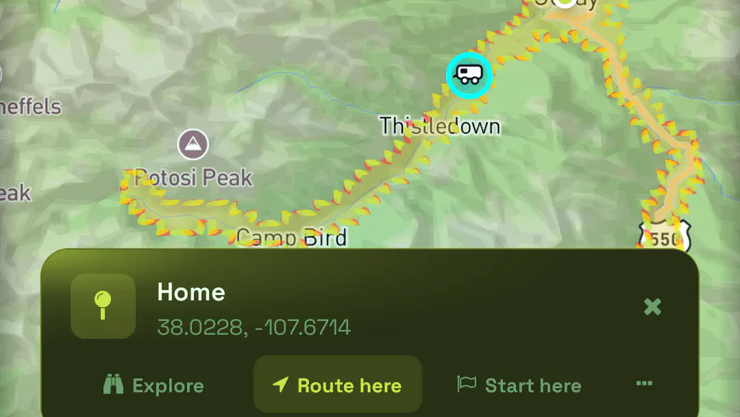 The Home card over the San Juan mountains with Explore, Route here and Start here actions, the reachability boundary crossing the valley behind it